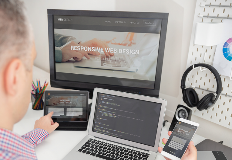 Designer working on responsive web design project.