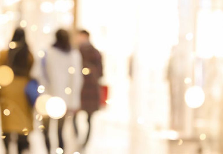 people walking through a mall