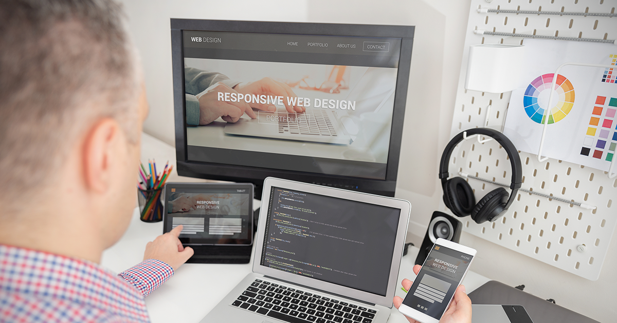Designer working on responsive web design project.